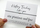 a person holding a card with a message on it